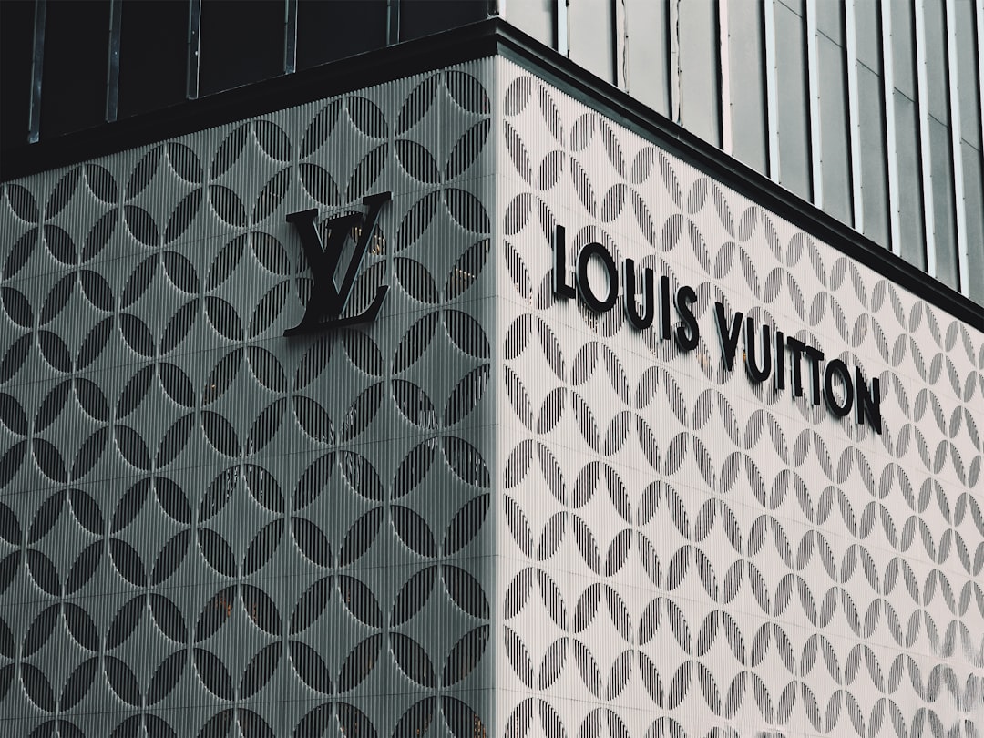 High Town, Luton: A louis vuitton sign on the side of a building